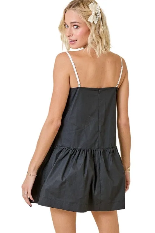 Black poplin mini dress with white contrast stitching